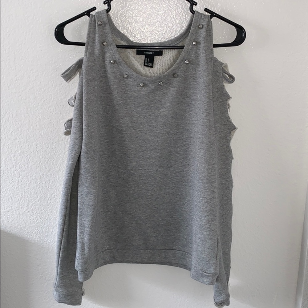 Cut out gray sweater with studded detail